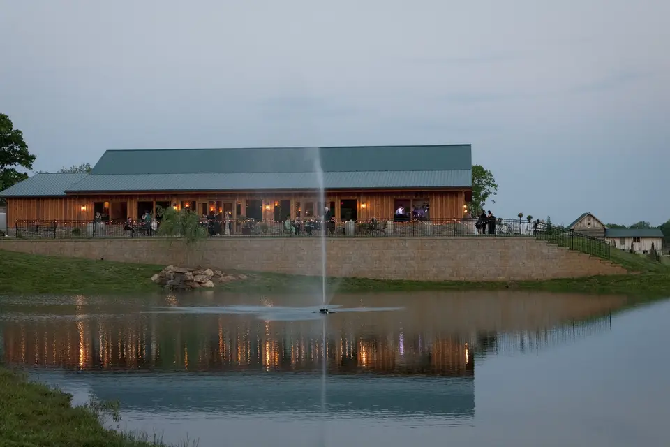Reception scene at Autumn Creek Vineyards with guests and candlelight